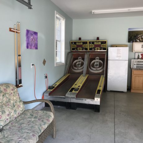 Skee ball games by refrigerator in recreational area