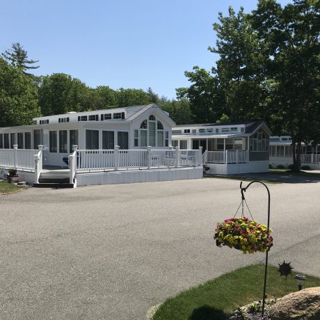 Exterior of Units at Seacoast Resort with flowers and big trees