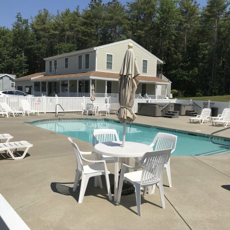Pool area with chairs and table